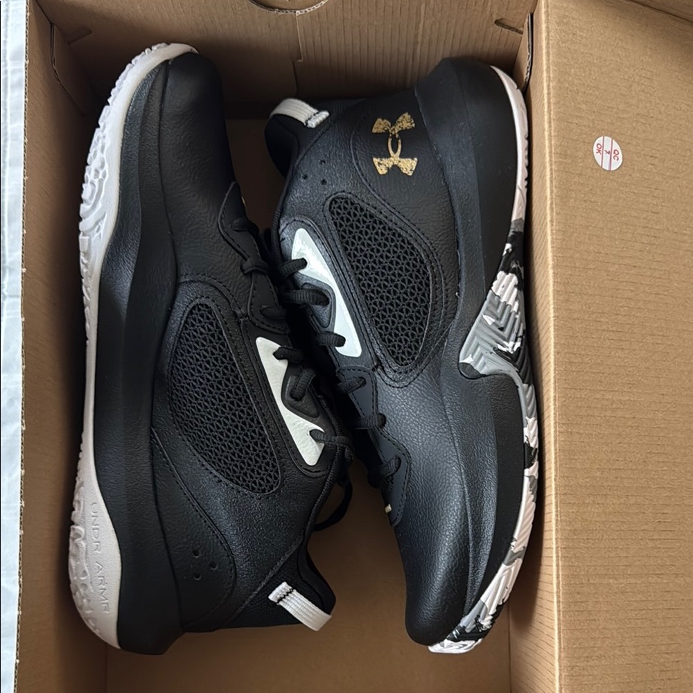 Under Armour Black and Gold Athletic Shoes with Low-Top Design